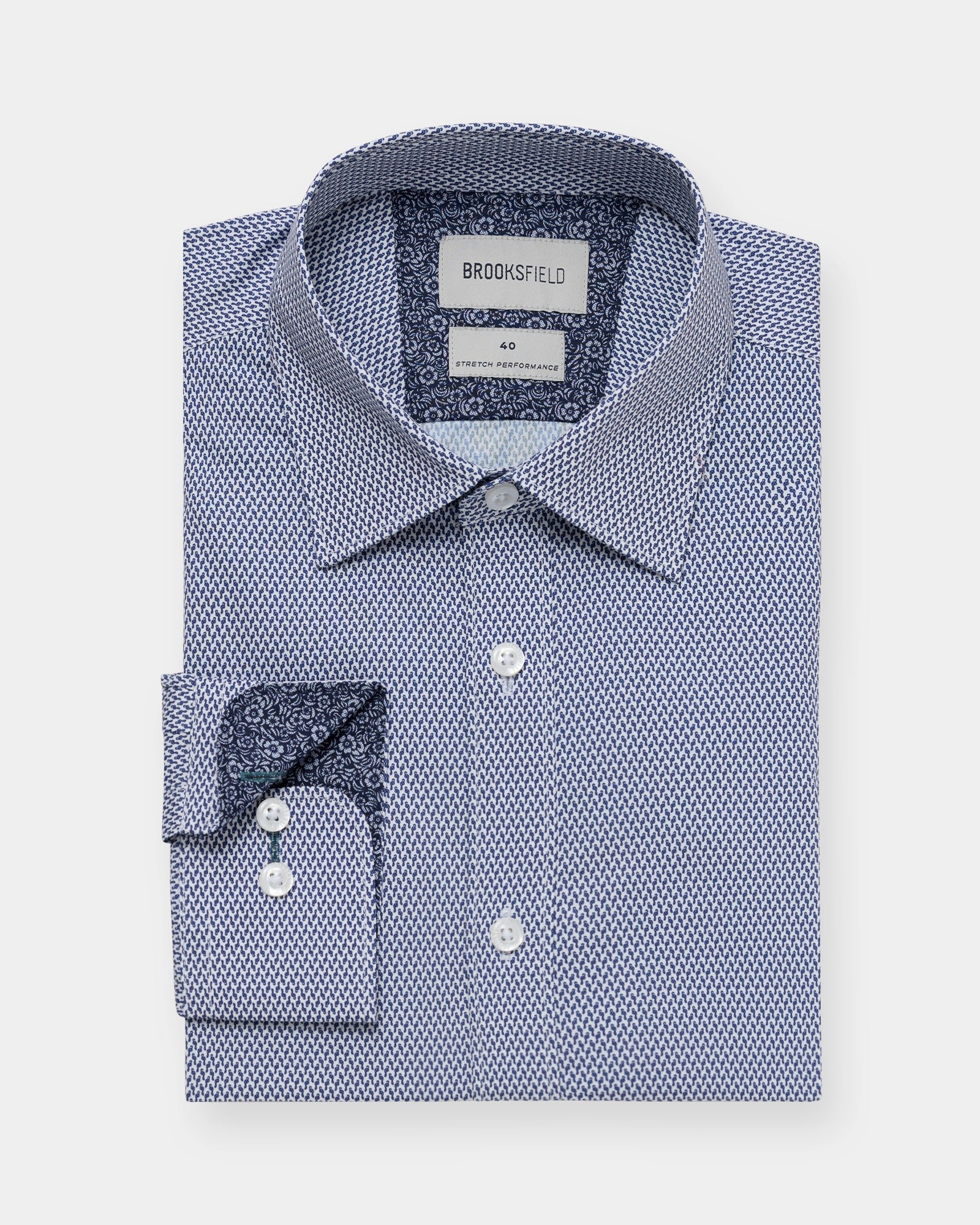 Straight-on view of a blue geometric performance shirt, comfortable regular fit with modern pattern