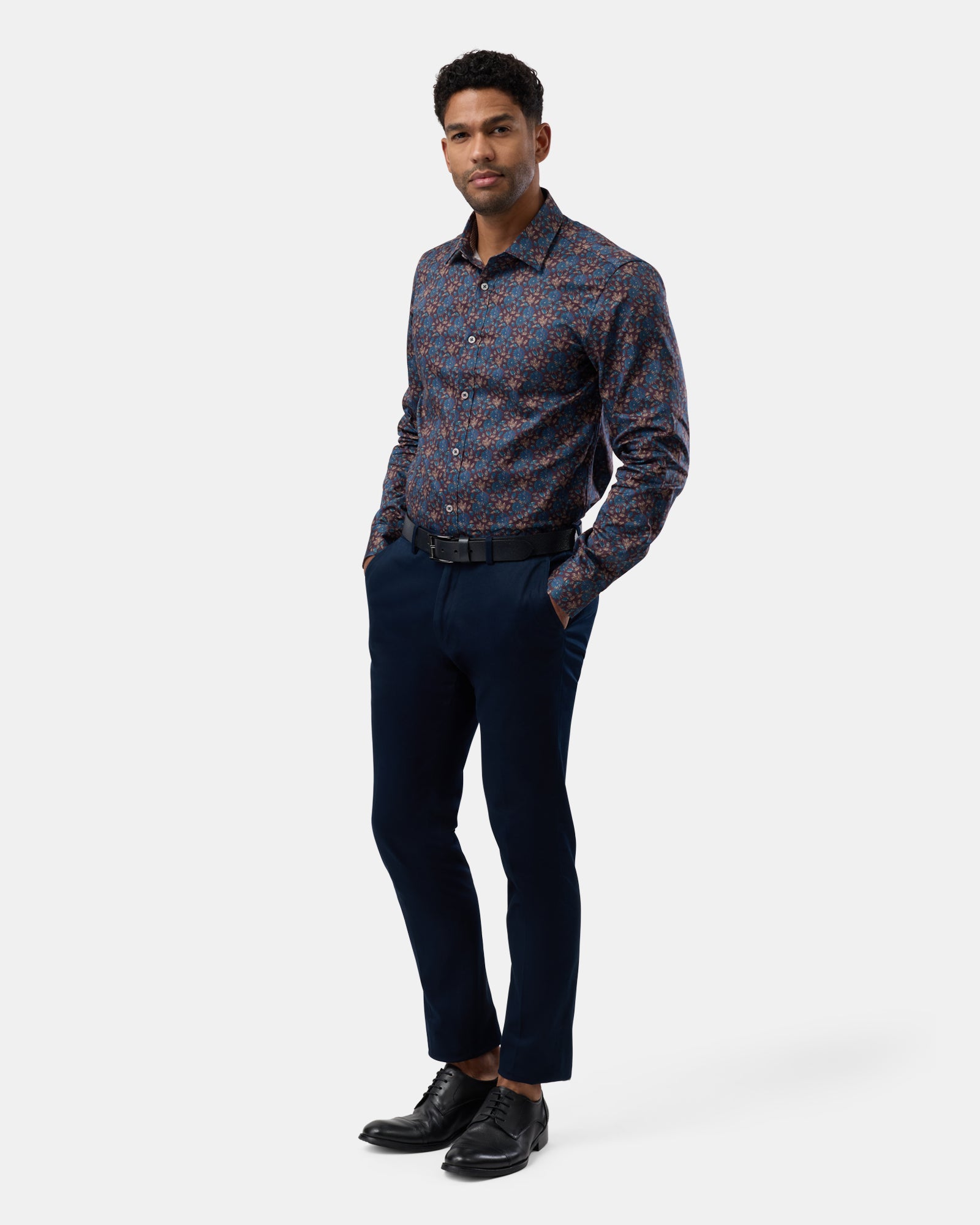 Side angle of brown floral patterned shirt, sleek tailored profile