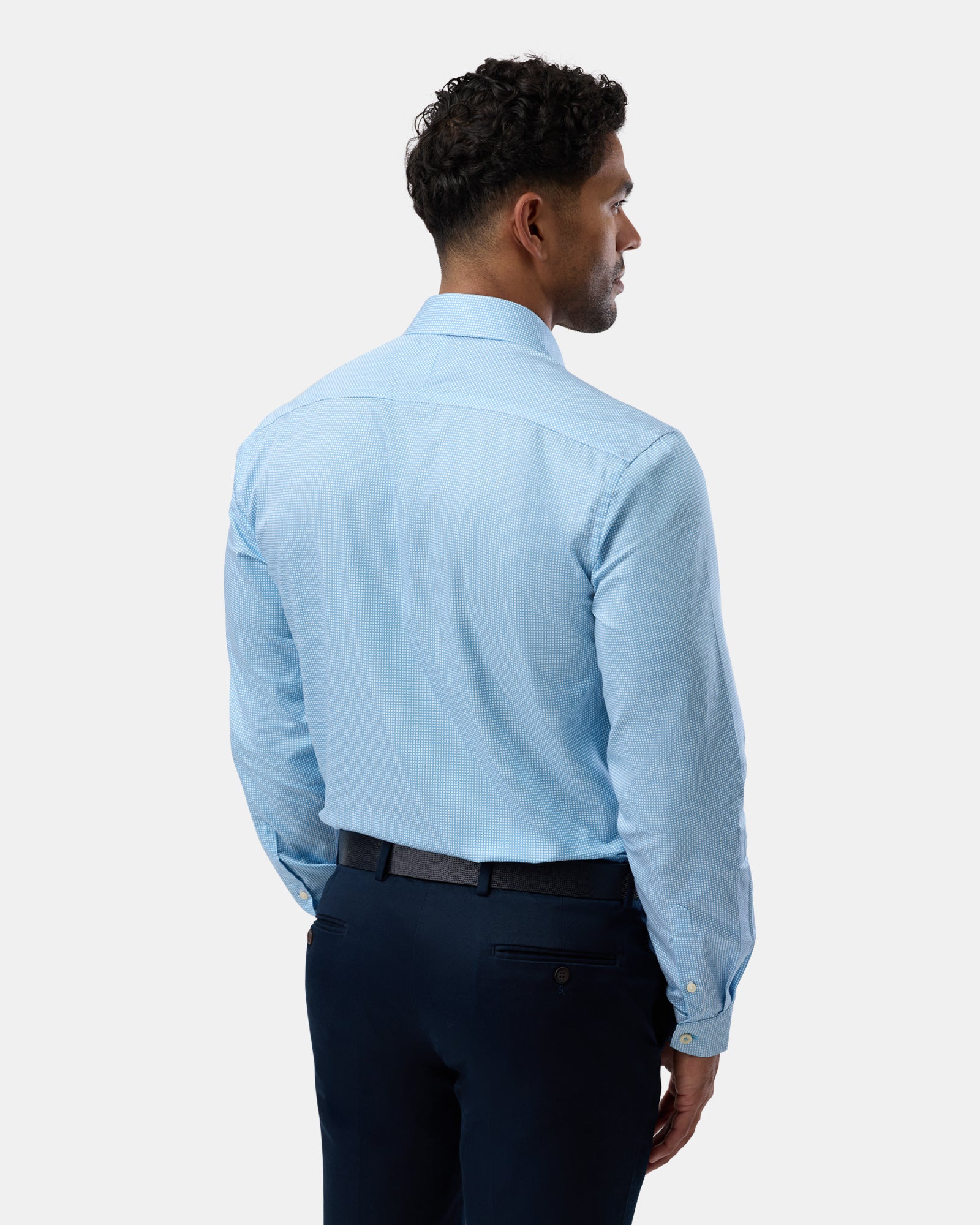 Rear view of blue slim-fit business shirt with subtle pattern, clean design