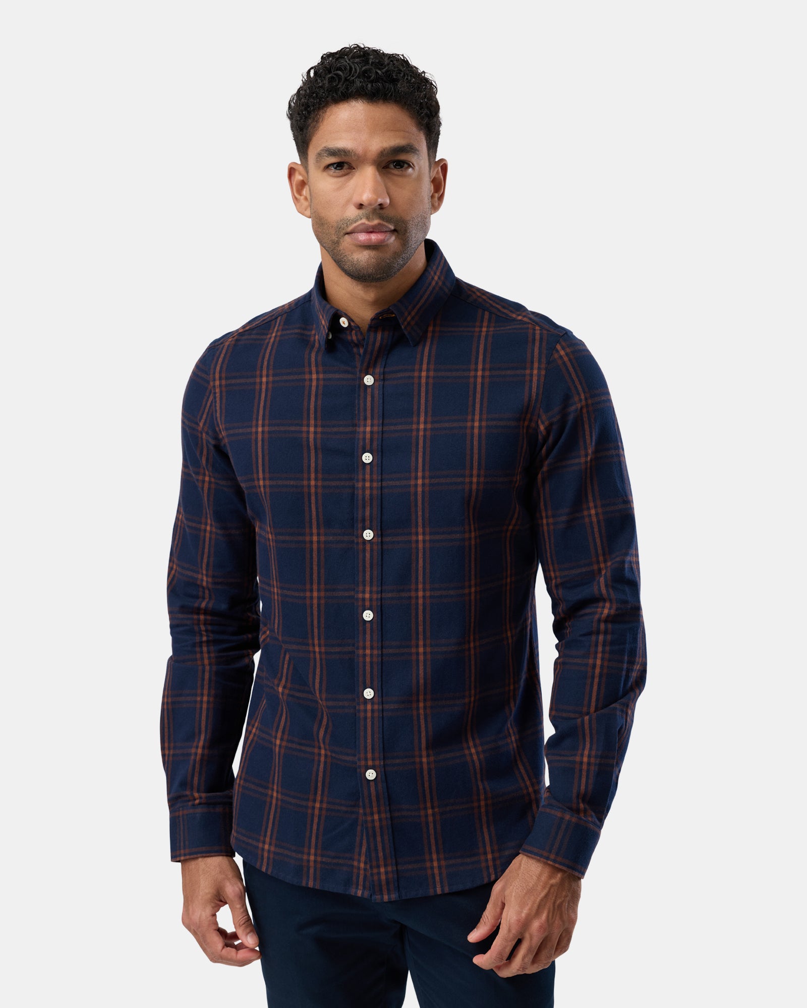 Front view of man wearing navy patterned long sleeve casual shirt