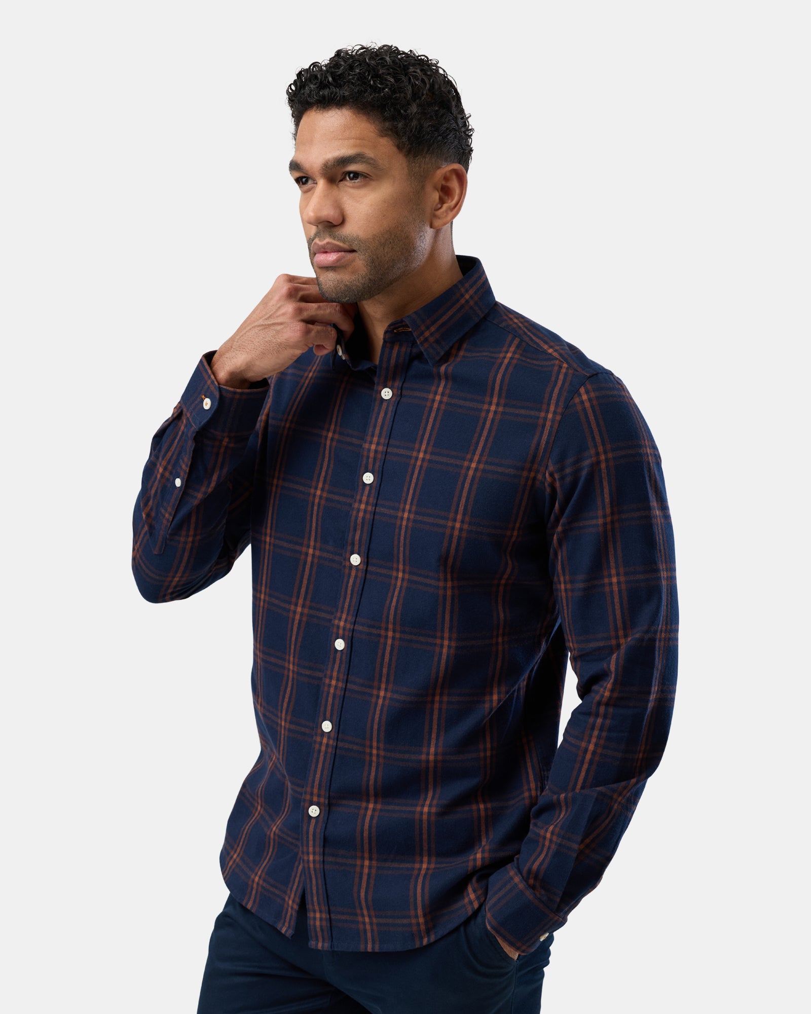 Side view of navy patterned shirt, long sleeves with comfortable fit