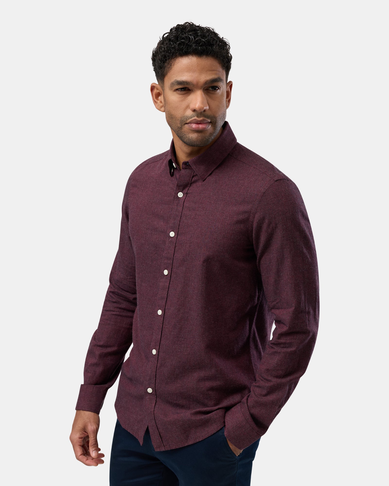 Side view of burgundy shirt, long sleeves with comfortable fit
