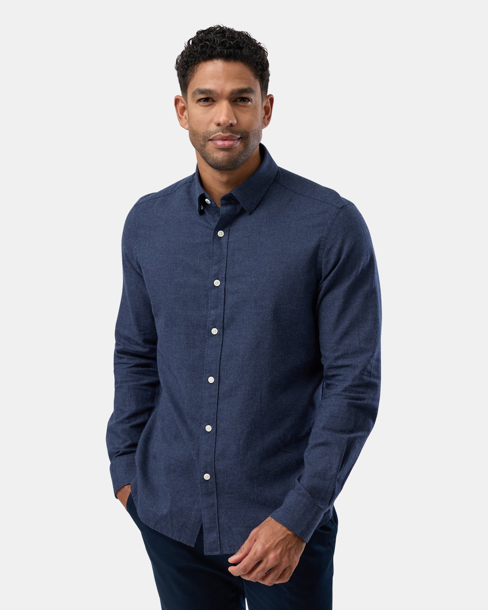 Front view of man wearing navy marl long sleeve casual shirt, relaxed fit