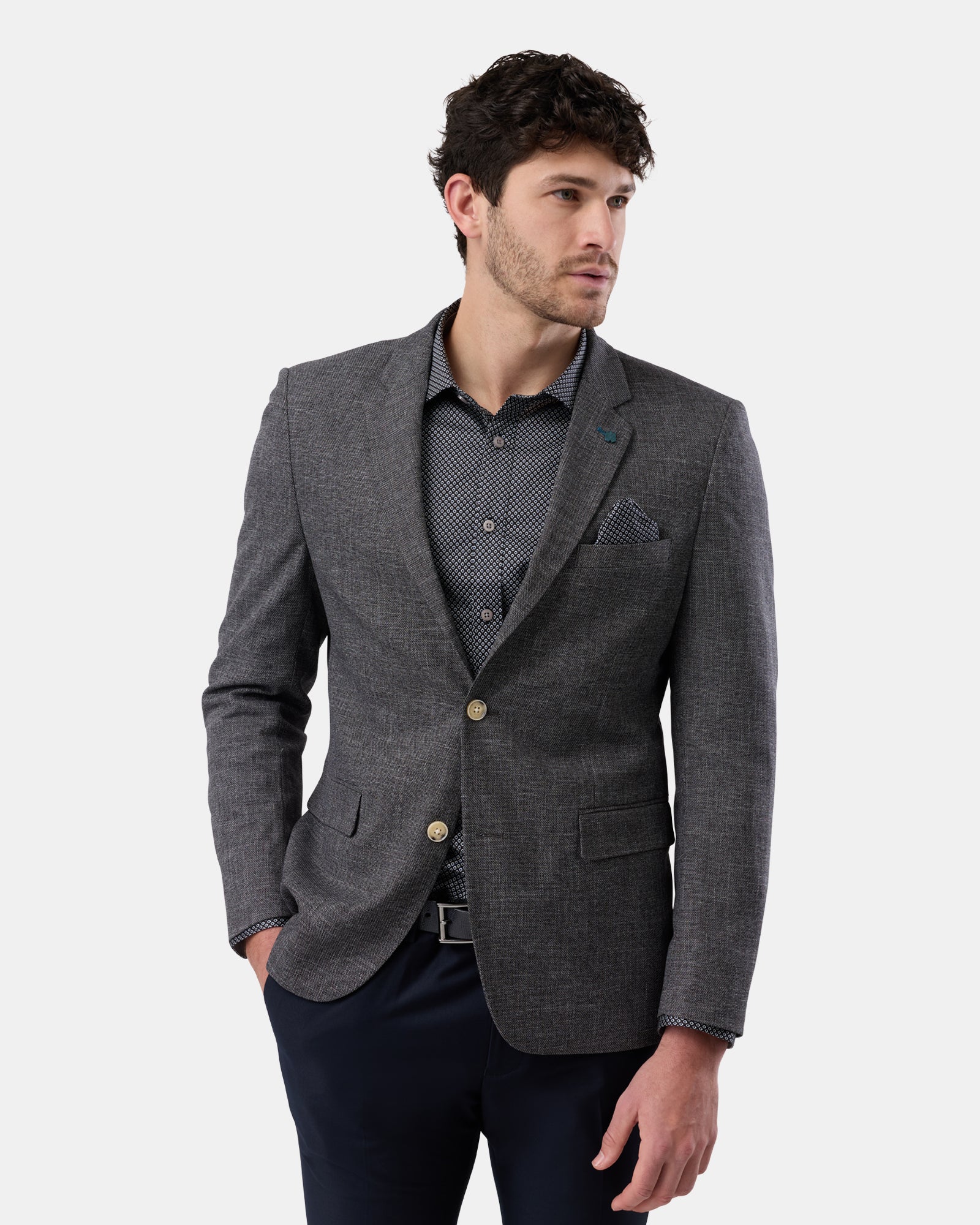 Front view of man in black tailored two-button blazer