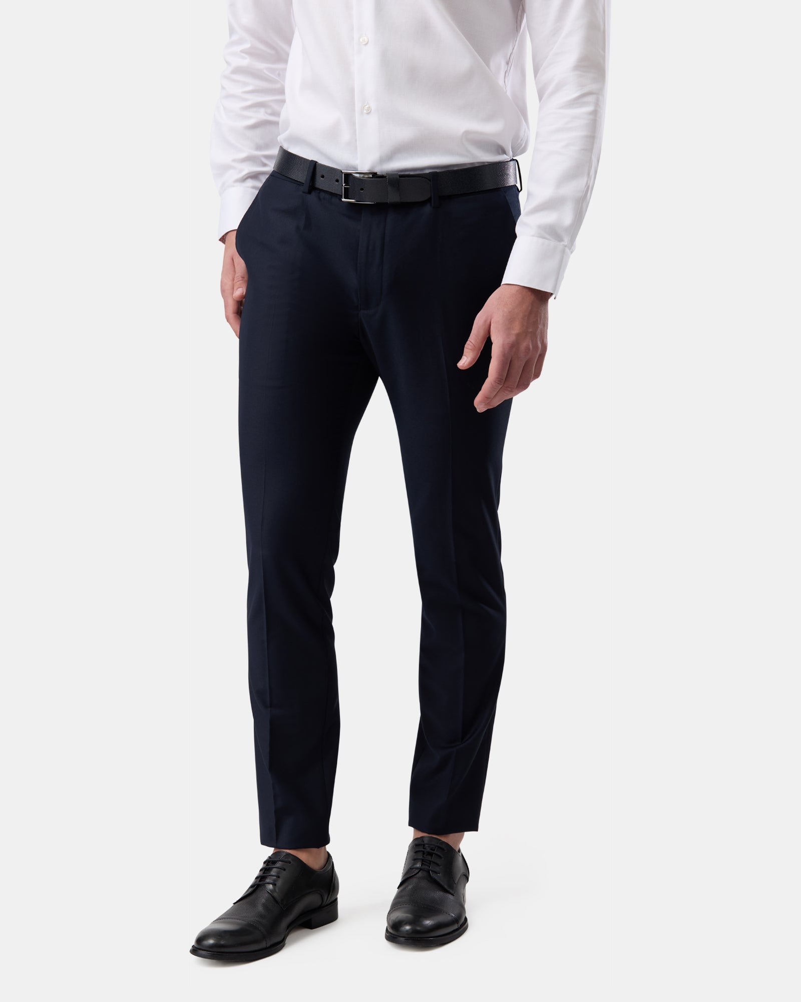 Profile of man wearing navy slim tailored trousers