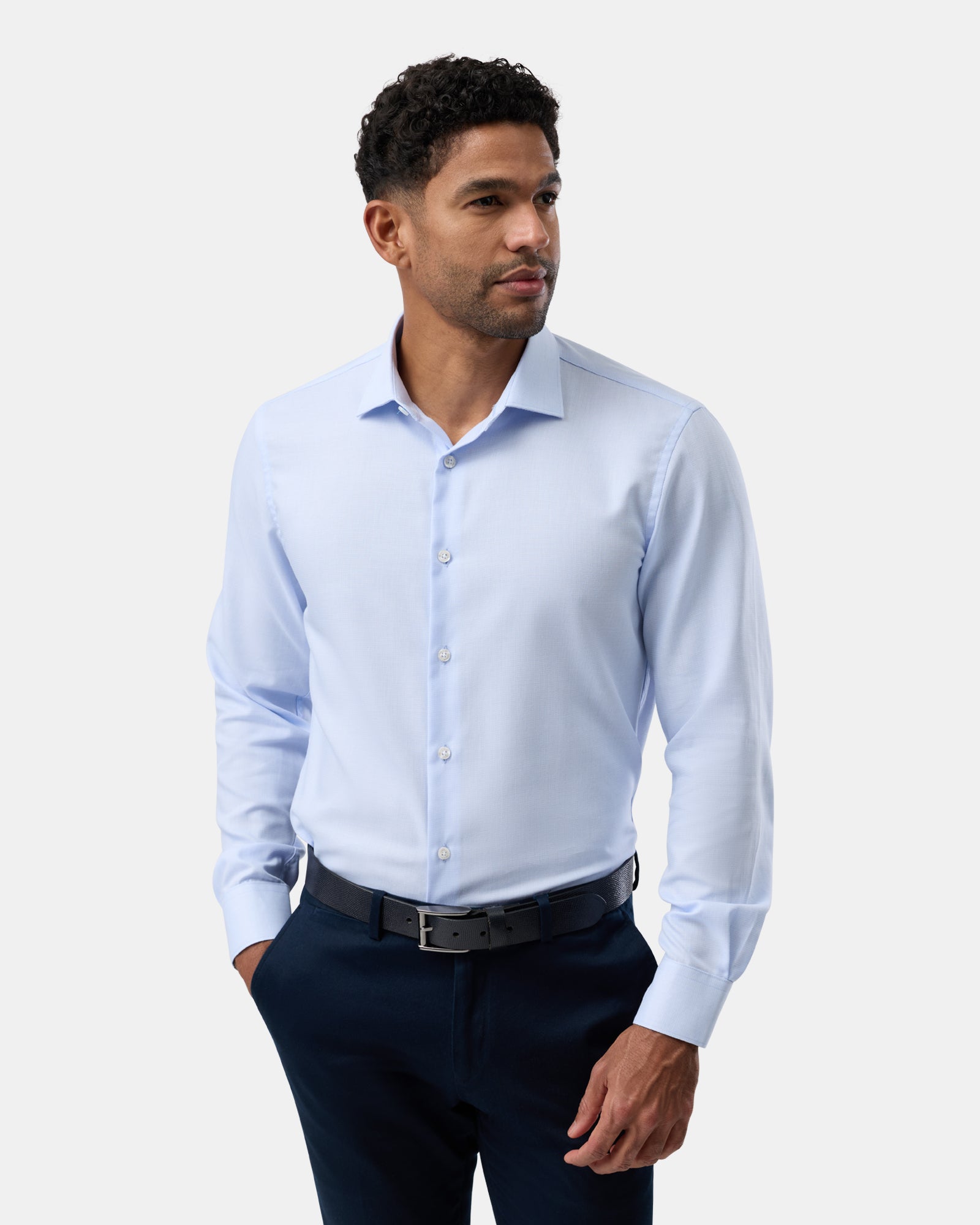 Displayed from the front, the light blue regular-fit shirt offers a clean, tailored appearance