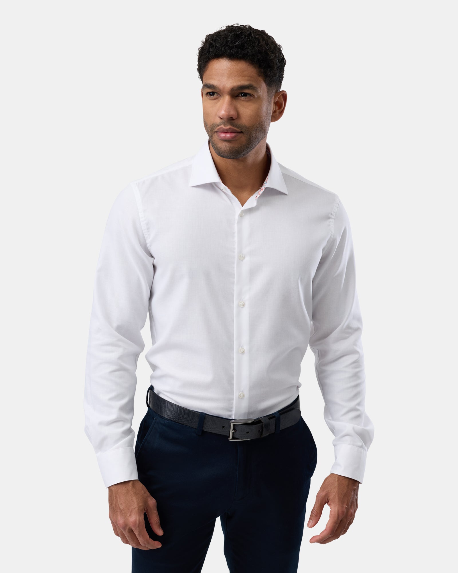 Front perspective of man wearing a white easy-care regular-fit shirt