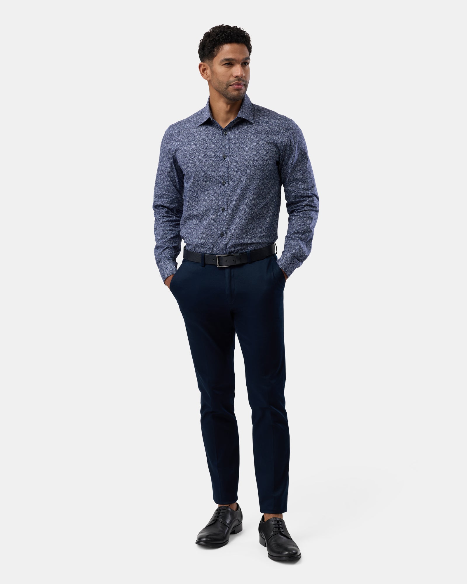 Entire outfit view featuring the navy floral regular-fit performance shirt, modern casual style