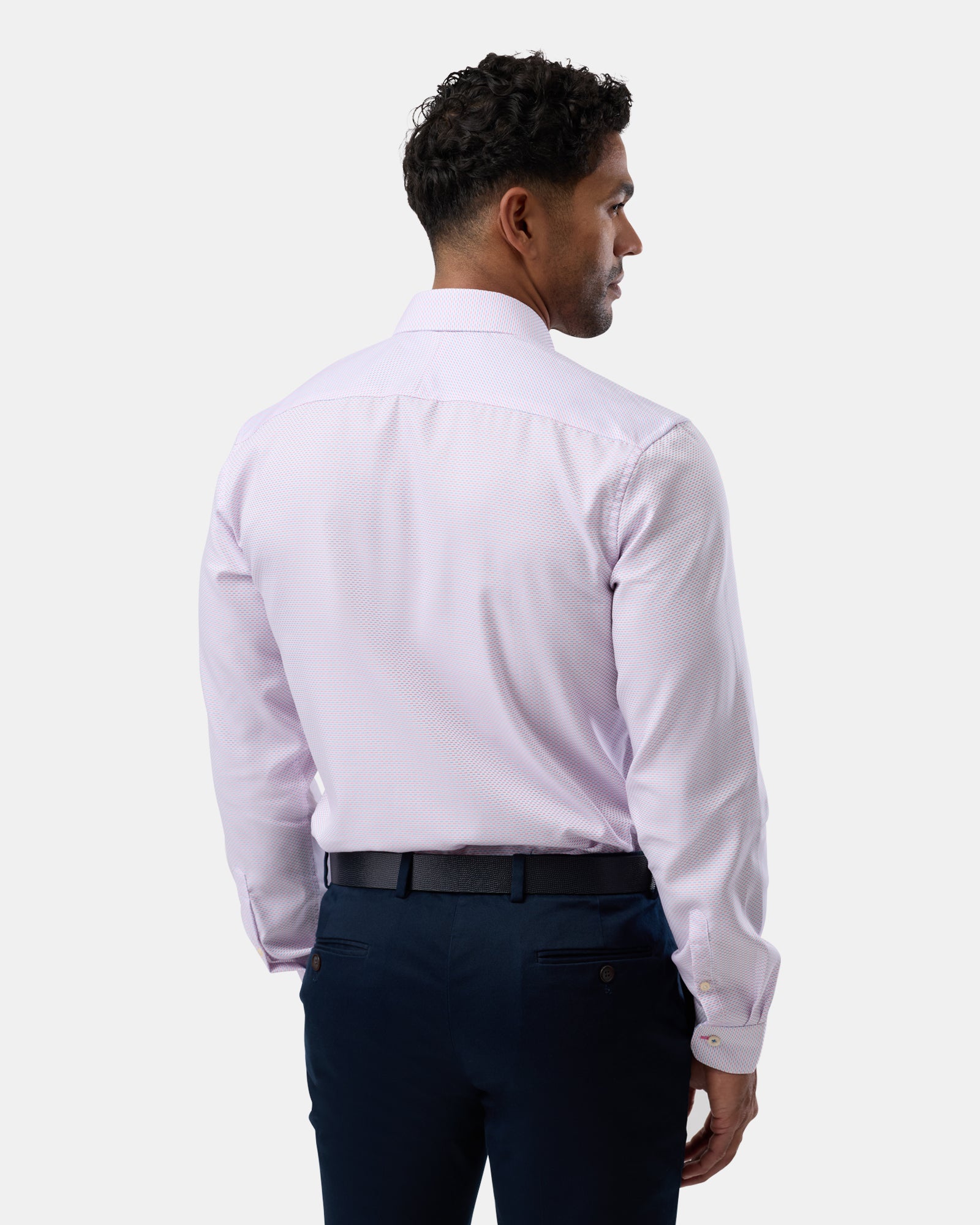 View from the back, showing the tailored fit and subtle pattern of the shirt