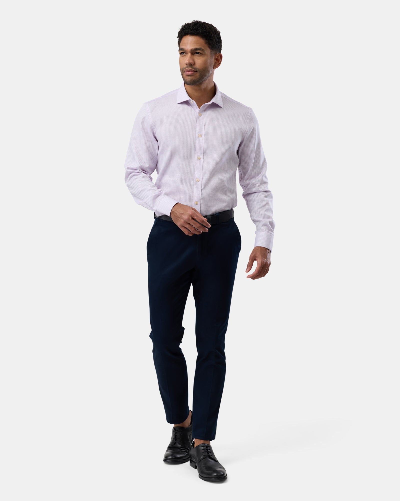 Entire outfit view featuring the pink patterned shirt, professional modern style