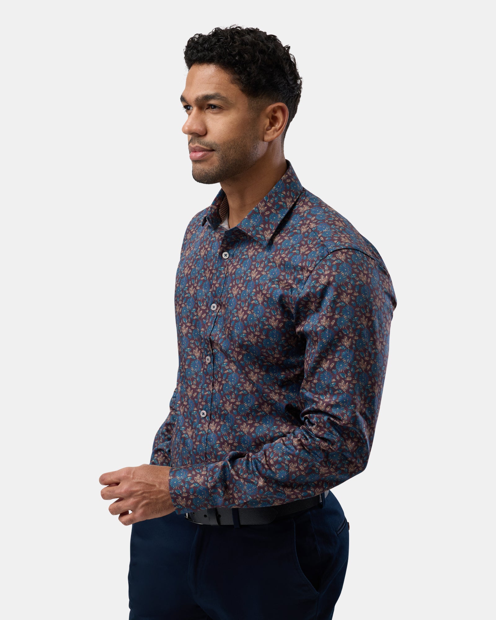 Profile perspective of man in brown floral business shirt