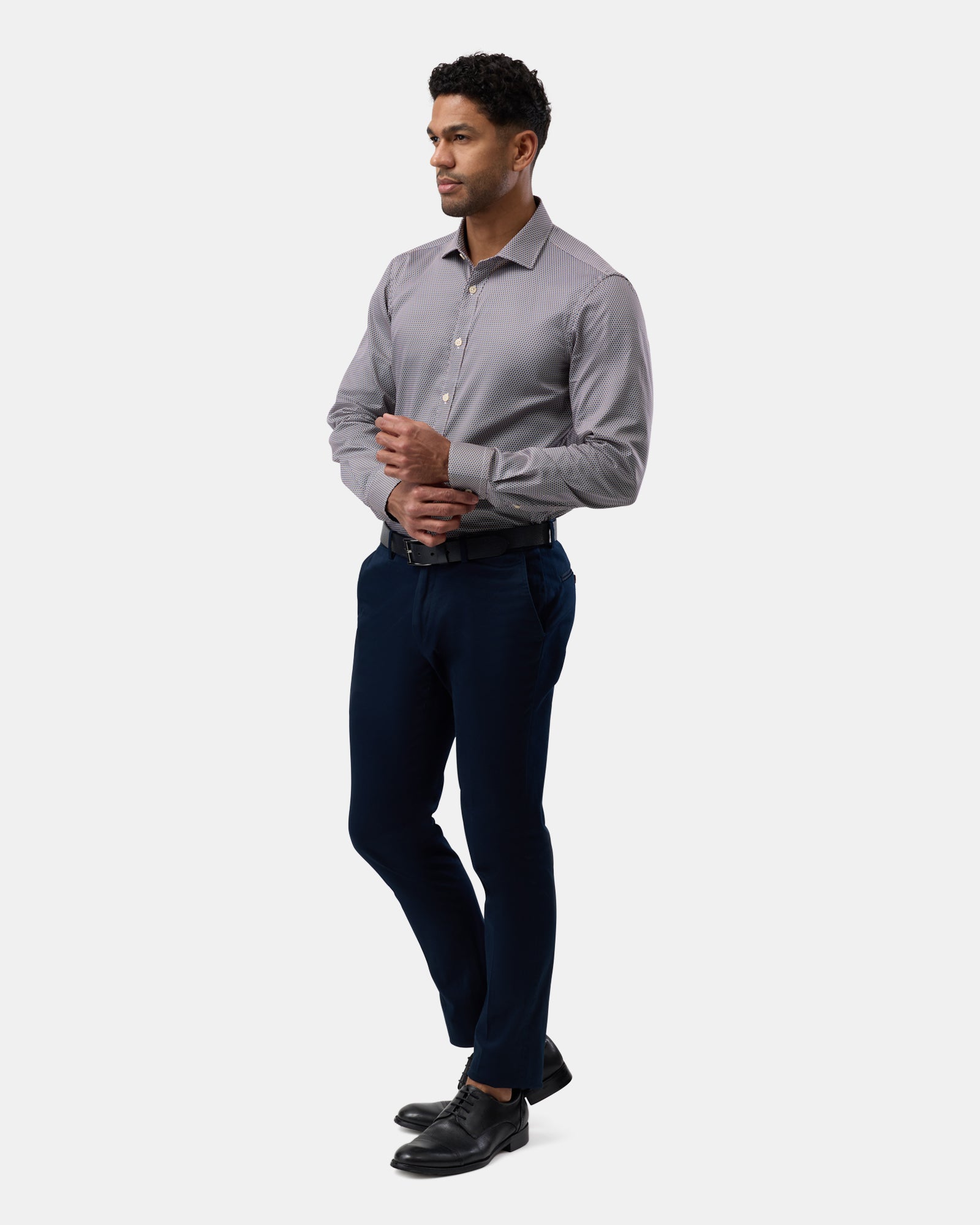 Side angle of brown slim-fit business shirt with subtle pattern, sleek profile