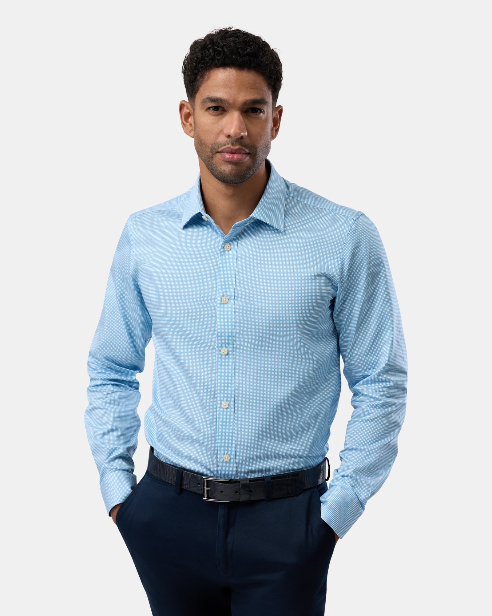 Front view of man wearing blue slim-fit business shirt with subtle pattern,