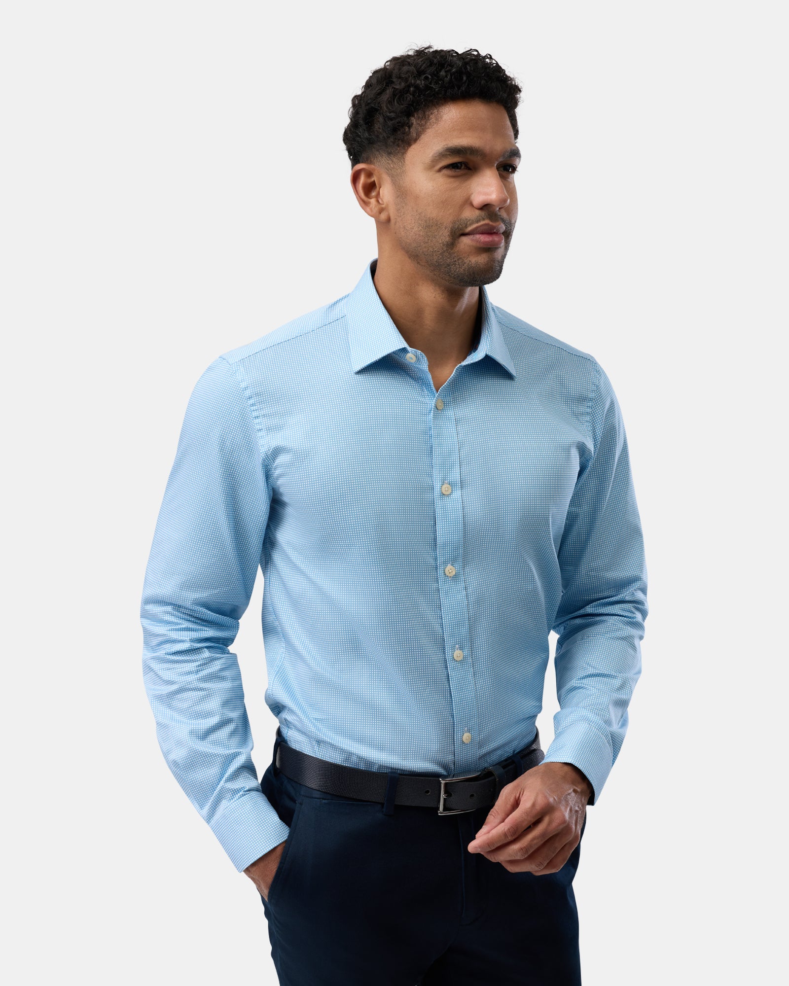 Profile of man in blue patterned business shirt