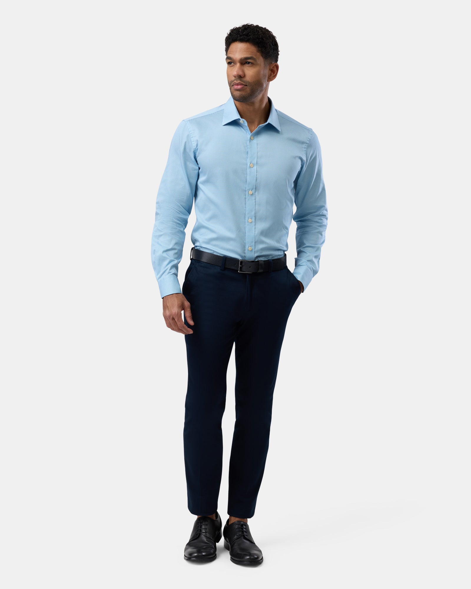 Full outfit view of blue patterned business shirt
