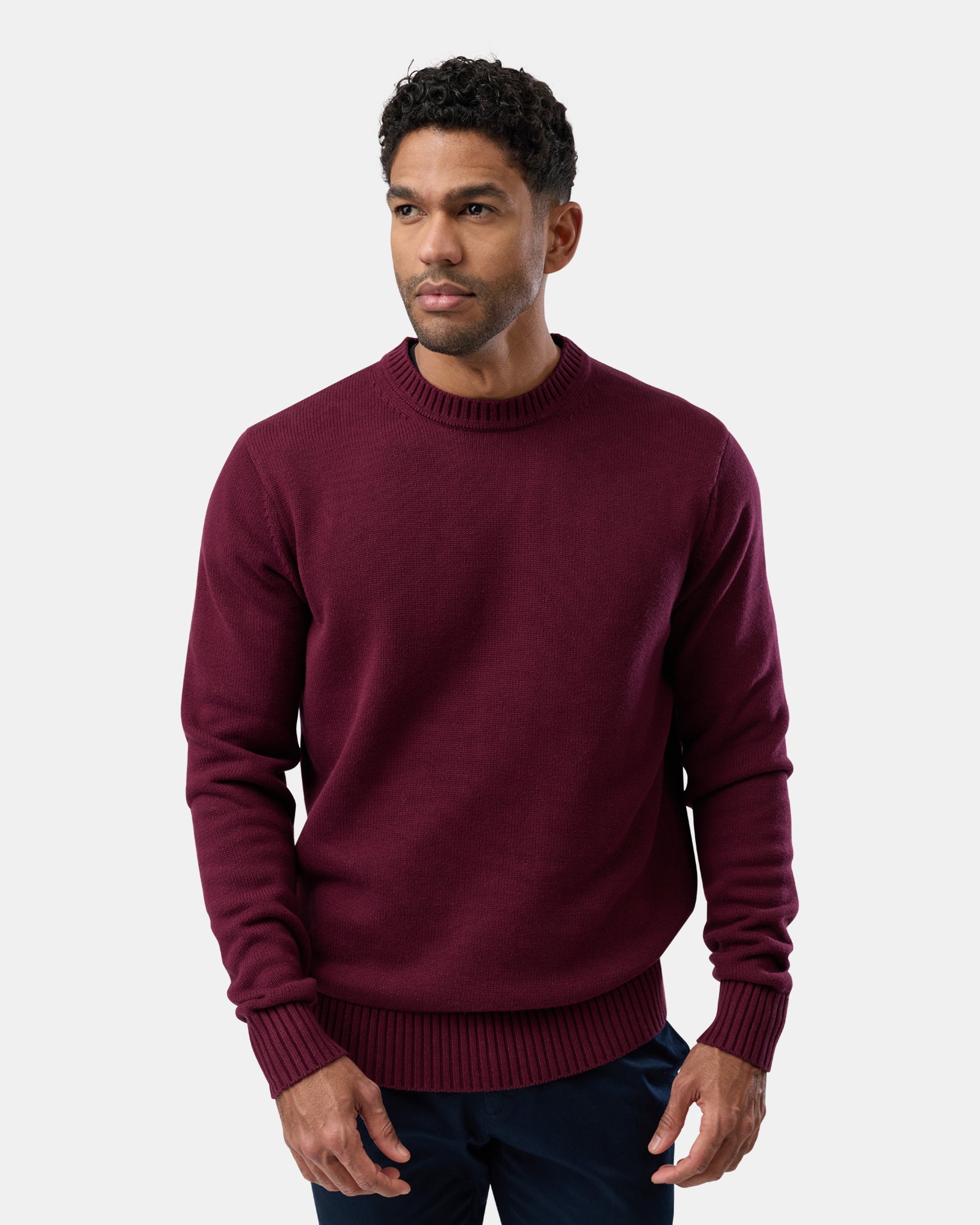 Man wearing a maroon cotton crew neck sweater