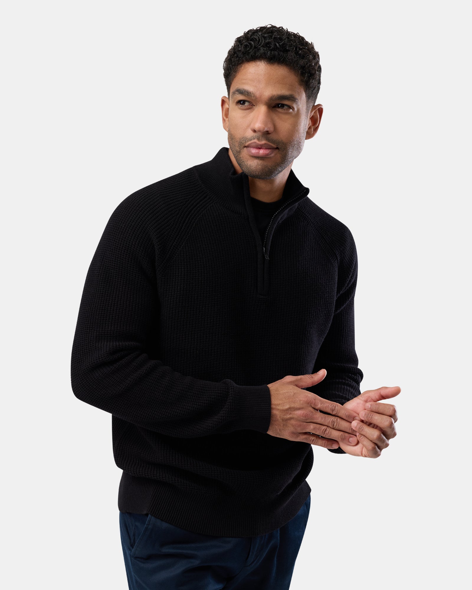 Male model in premium black half zip knit jumper