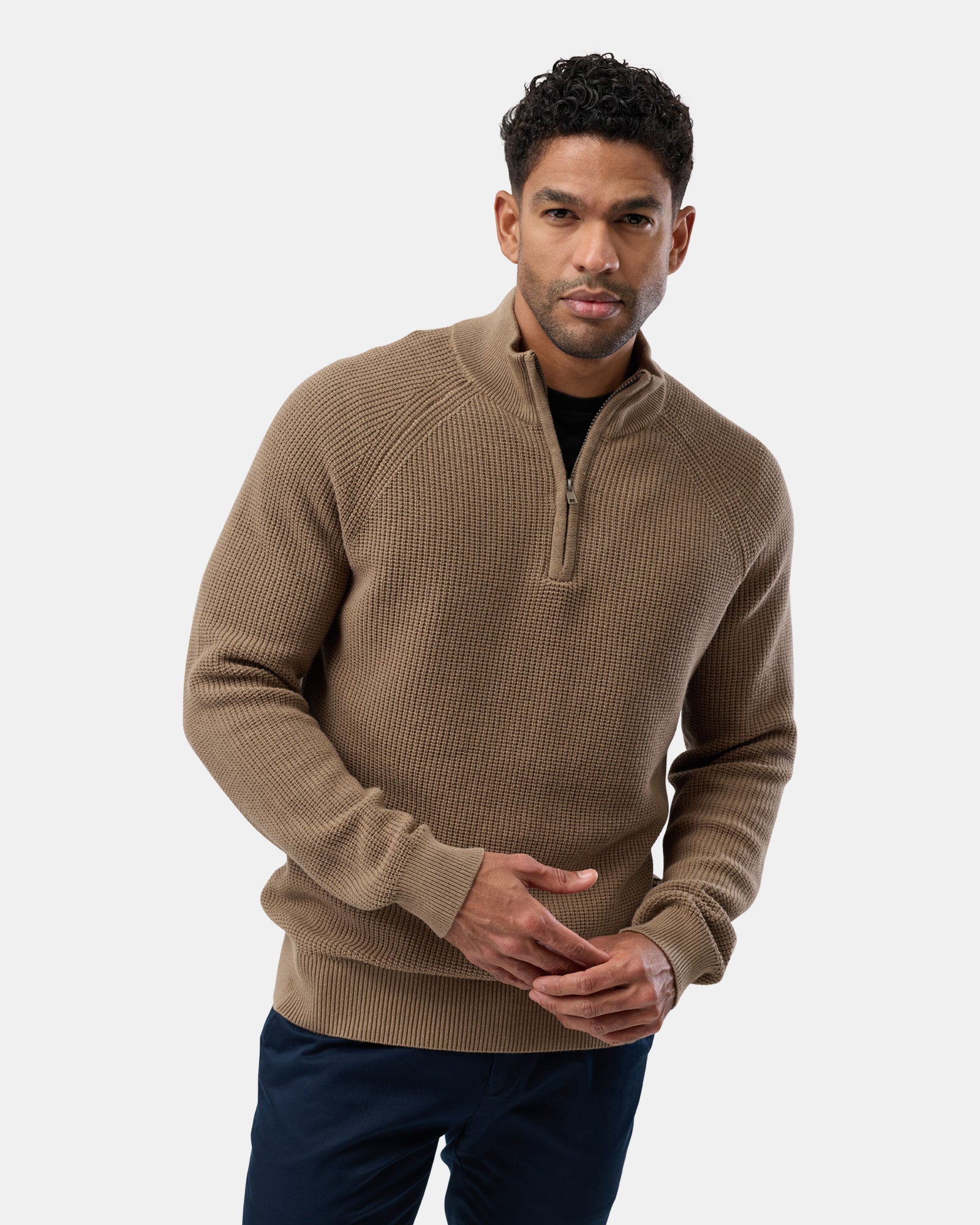 Man wearing a refined fawn cotton half zip knit sweater