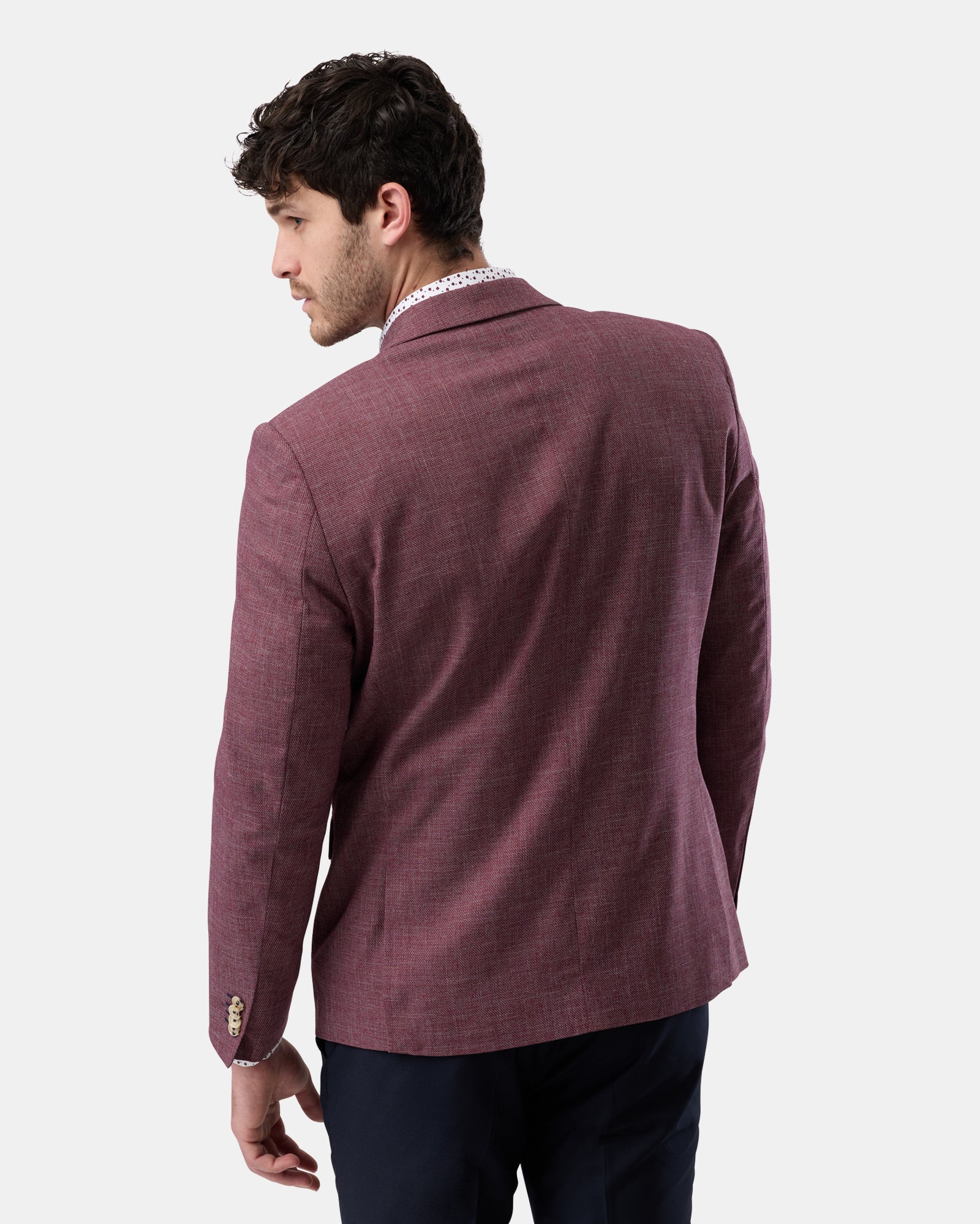 Back view of burgundy two-button blazer, fully lined design