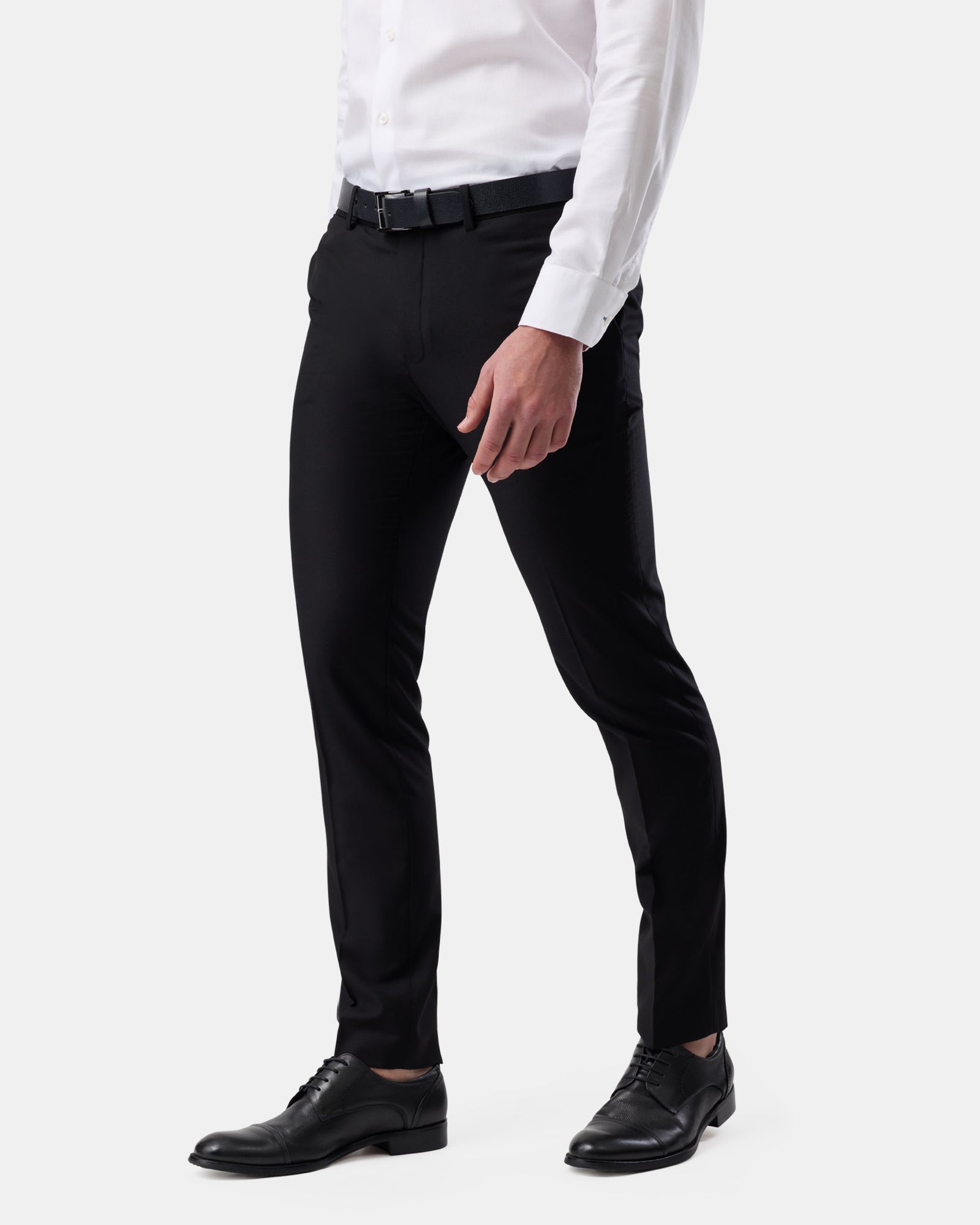 Side view of black tailored trousers on man, sleek profile