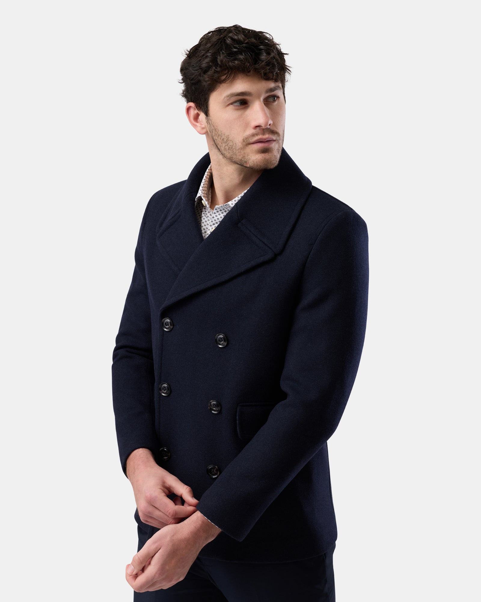 Man wearing a classic navy wool blend peacoat